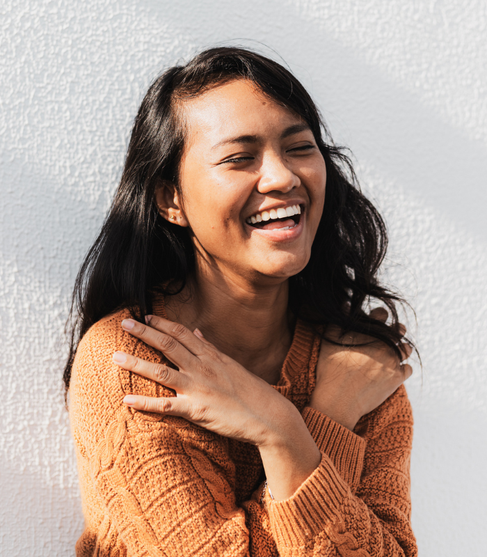 a happy woman after Therapy for Gaslighting