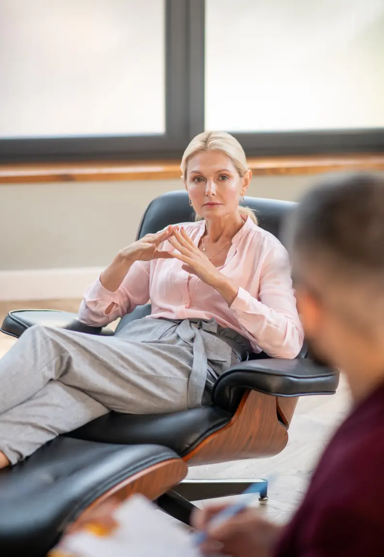 Person speaking with a therapist during an individual therapy session